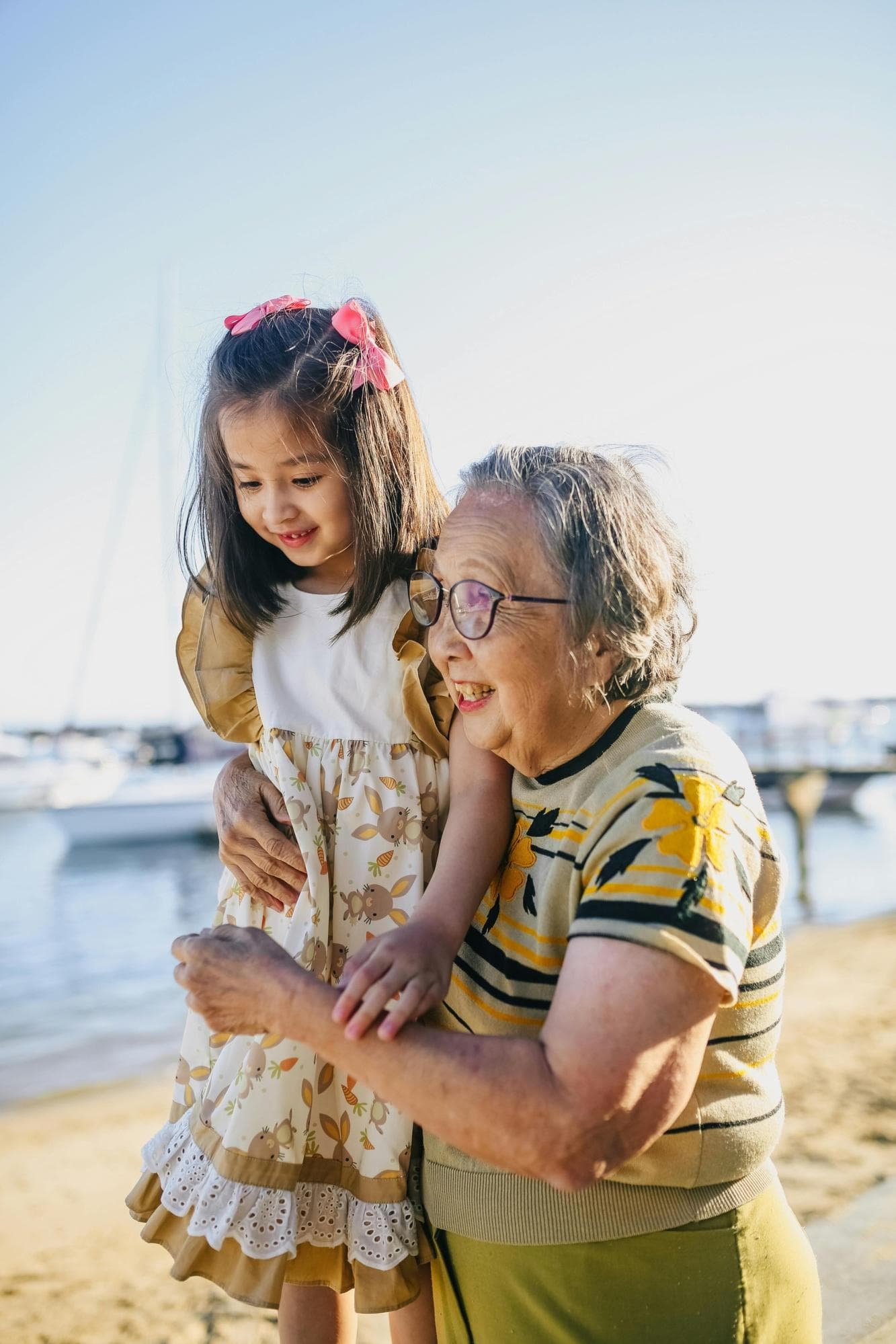 Older lady in yellow tshirt with child